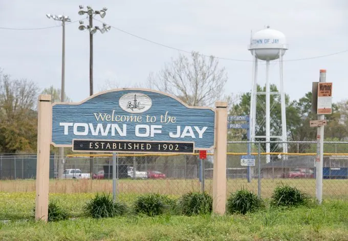 Welcome to the Town of Jay sign and municipal water tower in Jay, Florida