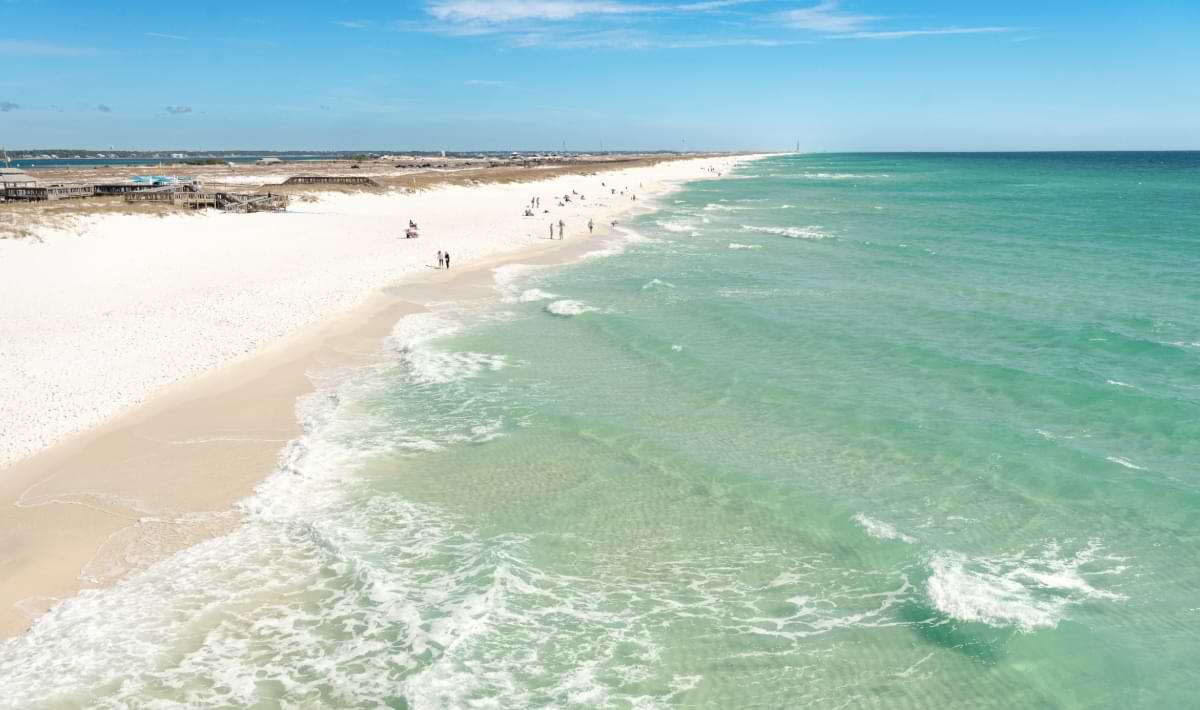 Emerald Gulf surf meeting the white sand shoreline at Navarre Beach, Florida